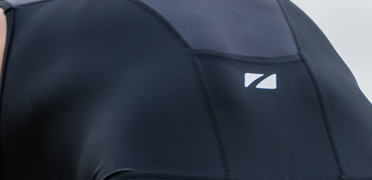 Close up of zone3 black activate+ sleeveless trisuit on a blurred background