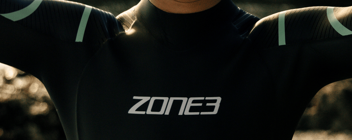Person wearing a Zone3 wetsuit with a blurred background