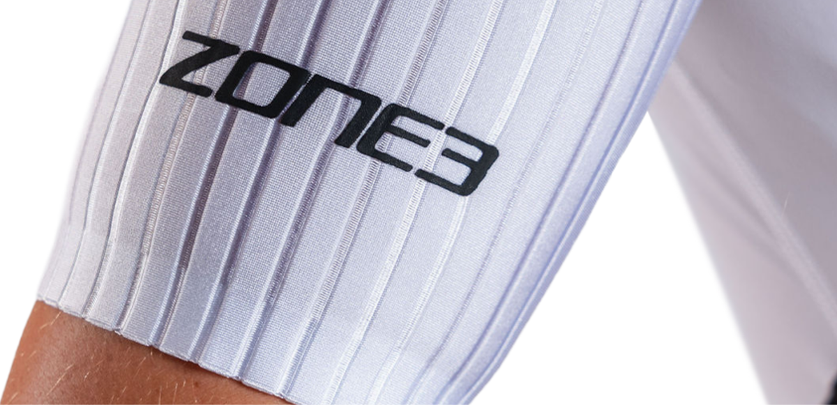 Close up of Lava Long Distance Full Zip Short Sleeve Trisuit on a white background