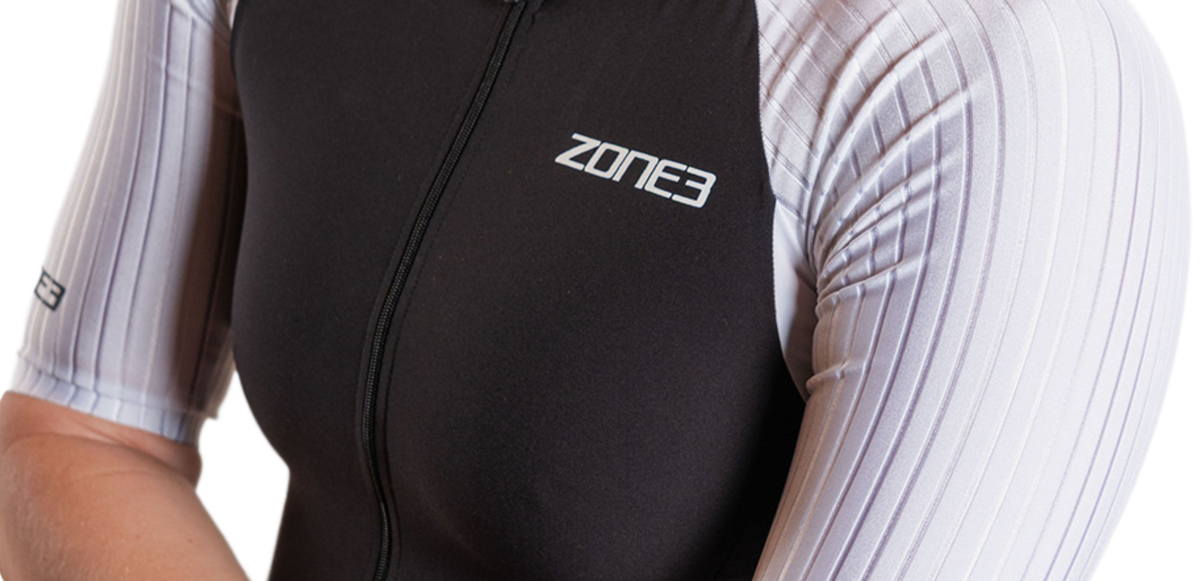 Close up of Lava Long Distance Full Zip Short Sleeve Trisuit on a white background